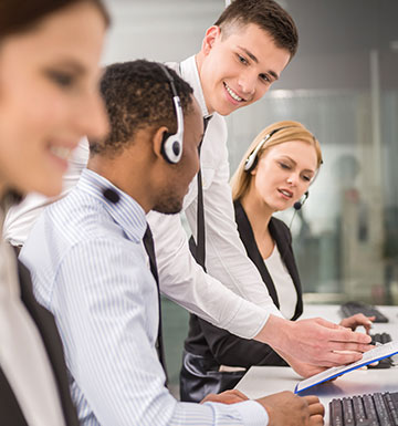 customer service scene with man wearing headset.